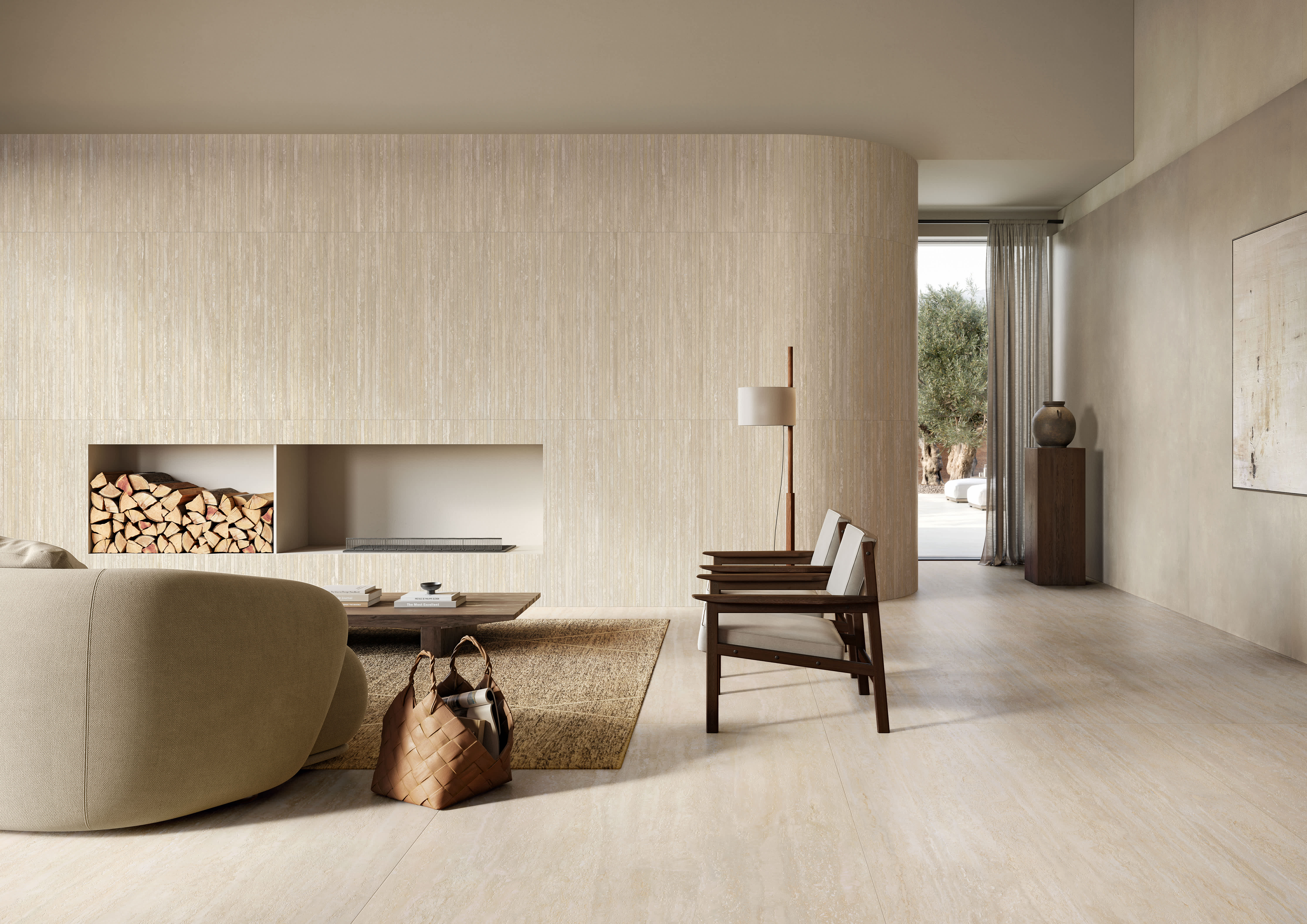Mega i Travertini porcelain slab in Beige installed as a feature wall and flooring in a warm minimalist living room with a curved sofa, wood chair and built-in firewood niche