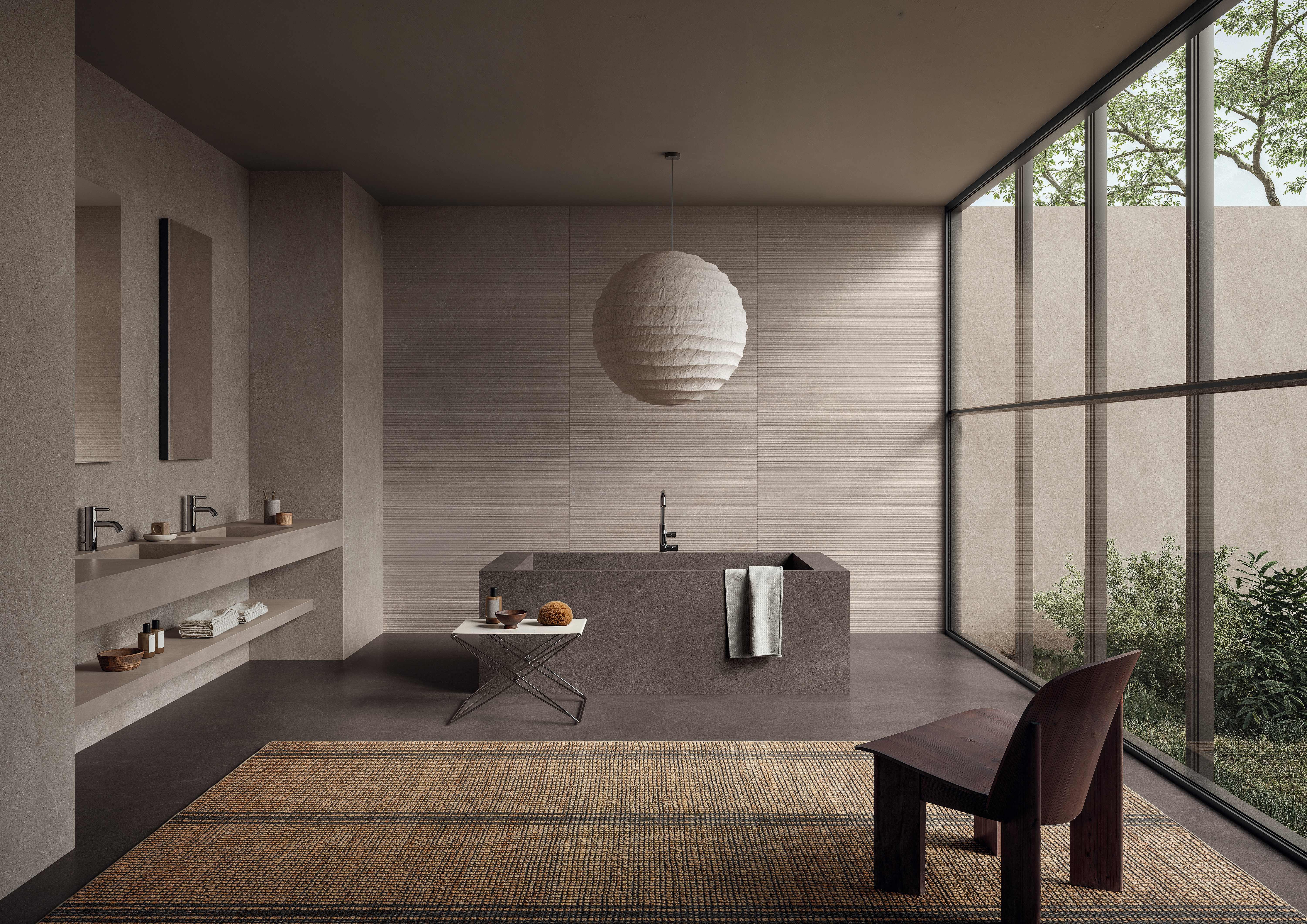 Warm taupe Natural porcelain bathroom with a dark espresso-brown floor, freestanding tub and full-height garden glazing.