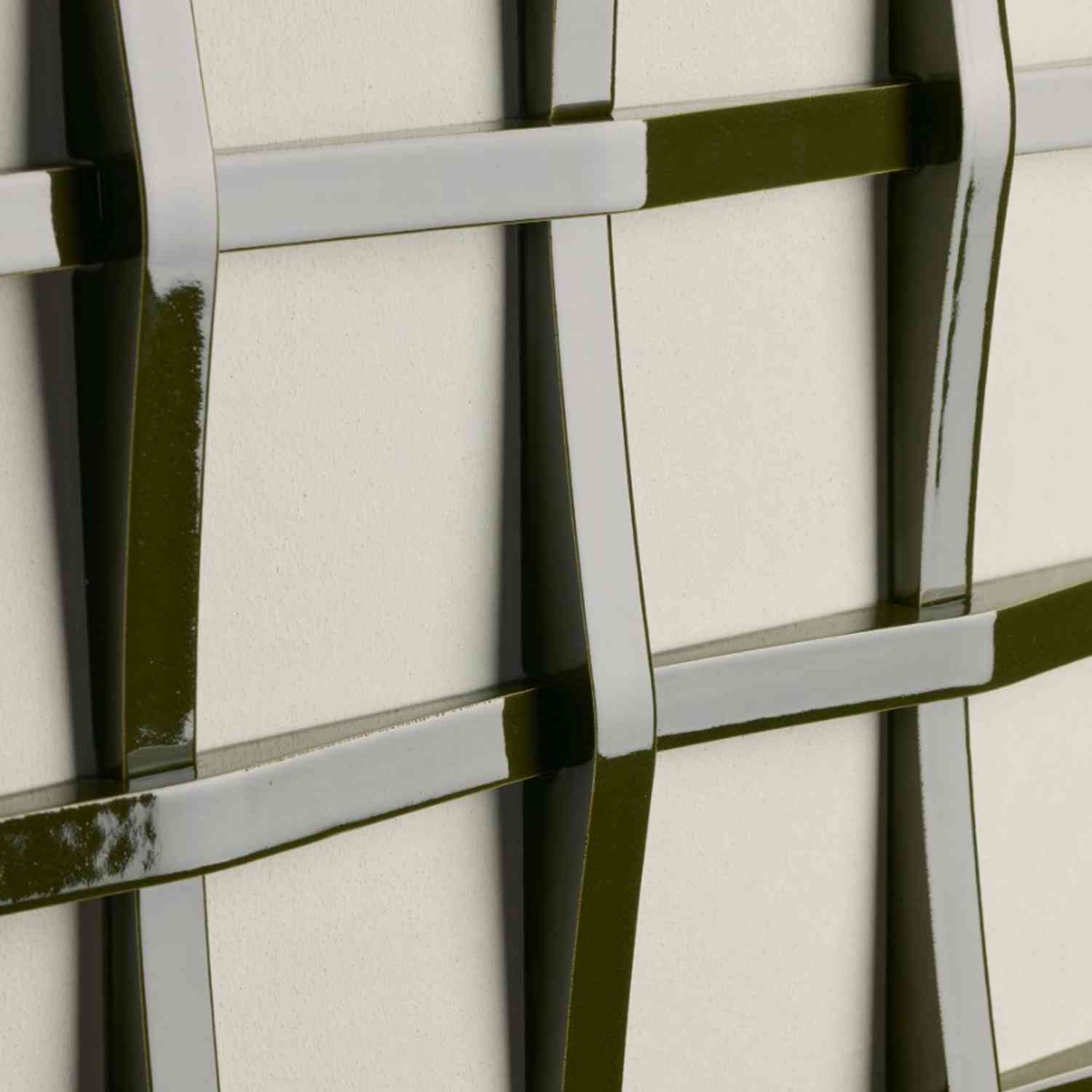 Mutina Adagio glazed ceramic tile close-up in verde and bianco with interwoven sculptural grid relief