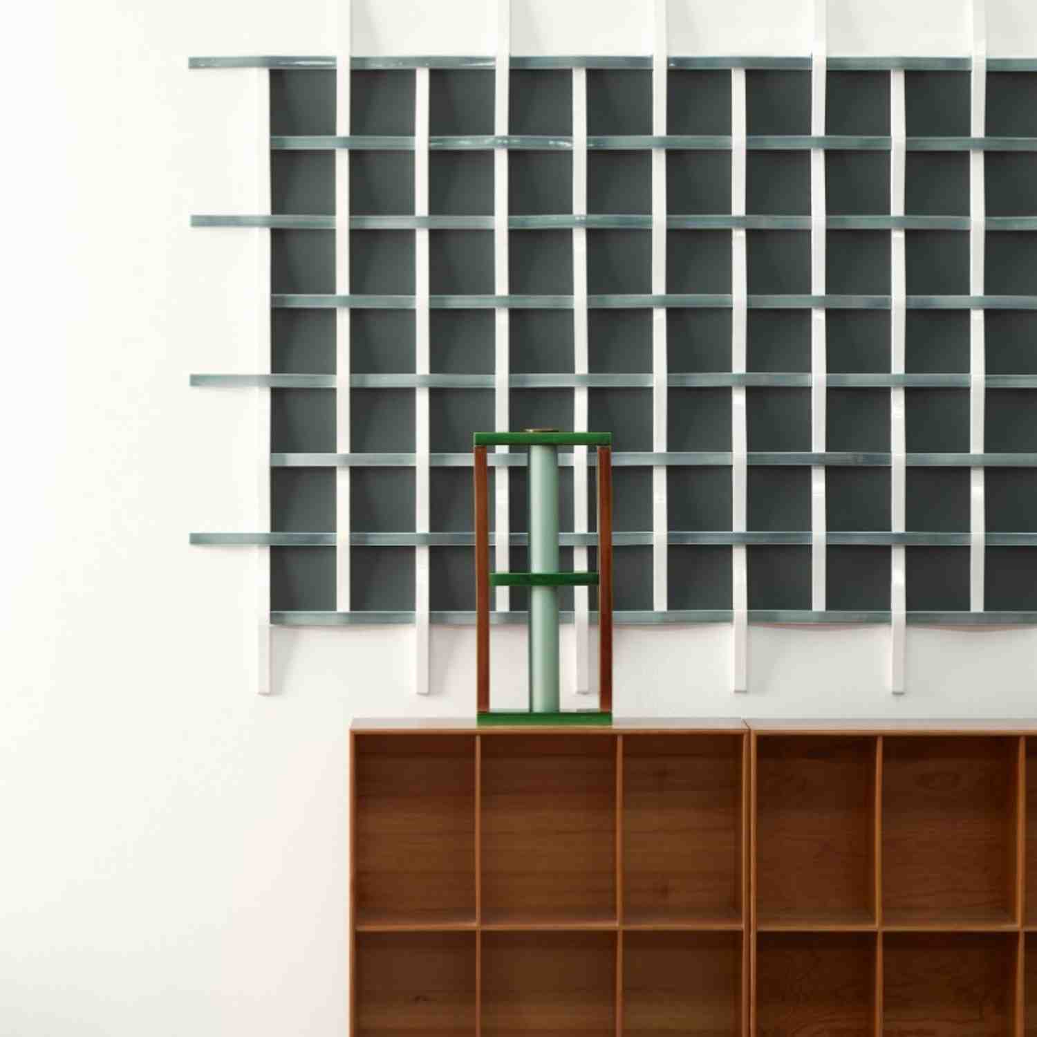 Mutina Adagio grigio ceramic wall installation with three-dimensional grid texture and green accent stool