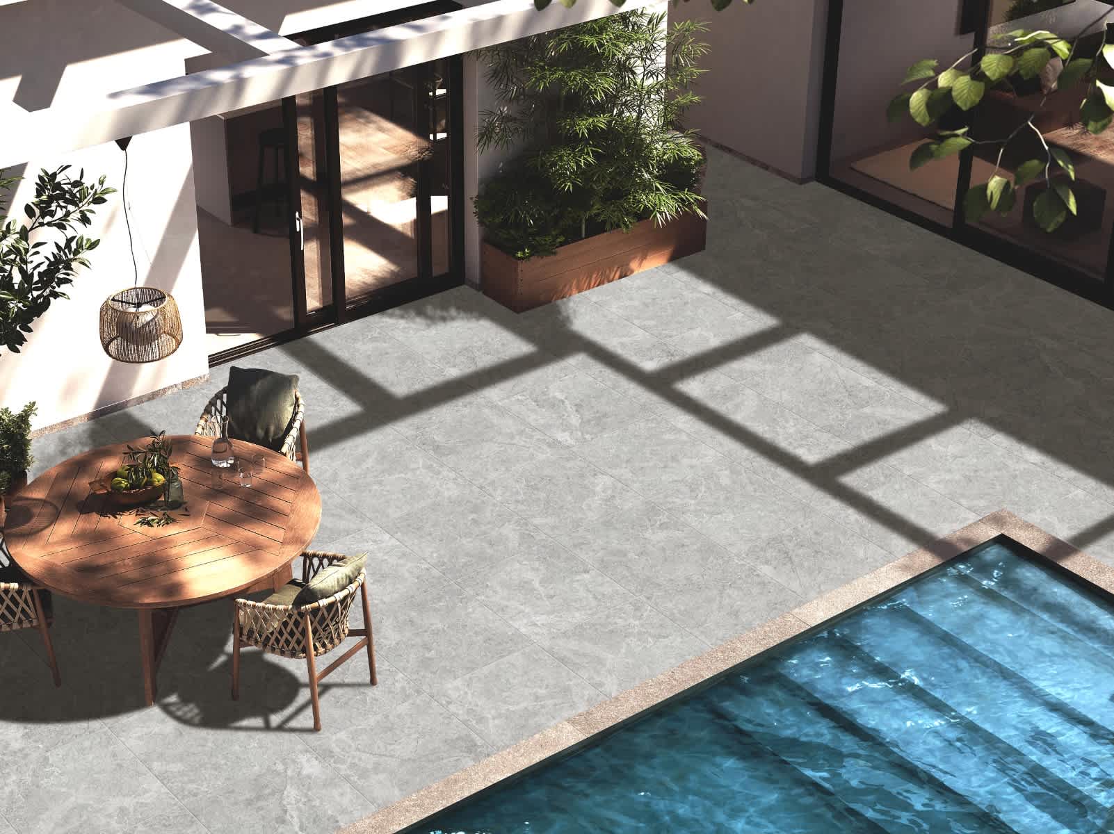Max Glory Antalya glazed porcelain tile outdoor poolside patio with stone-look tiles round wooden dining table wicker chairs rattan pendant light and swimming pool