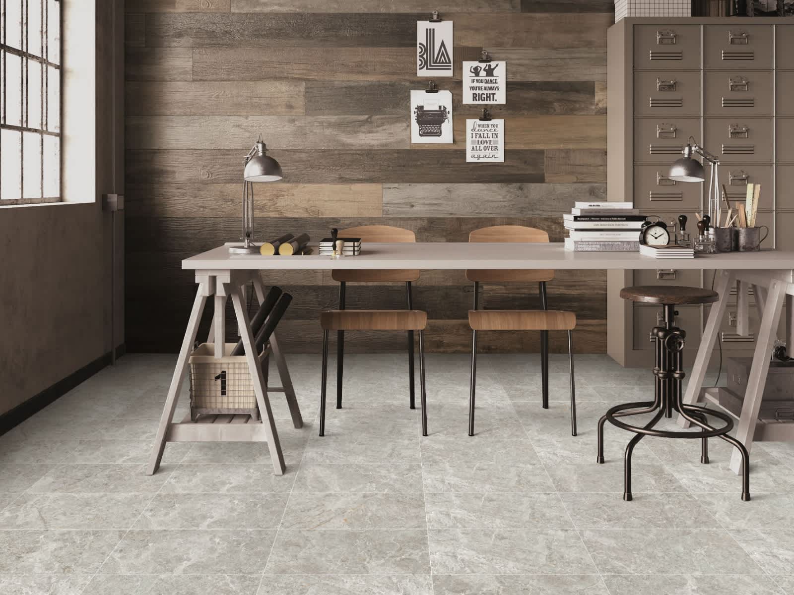 Max Glory Antalya Grey glazed porcelain tile rustic industrial workspace with stone-look floor tiles wooden plank accent wall sawhorse desk industrial chairs and desk lamp