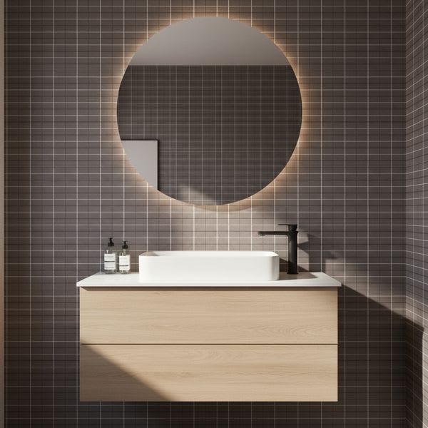 Mutina Aurore Charcoal glazed porcelain stoneware bathroom with grid tile wall round backlit mirror white vessel sink black faucet and light wood floating vanity