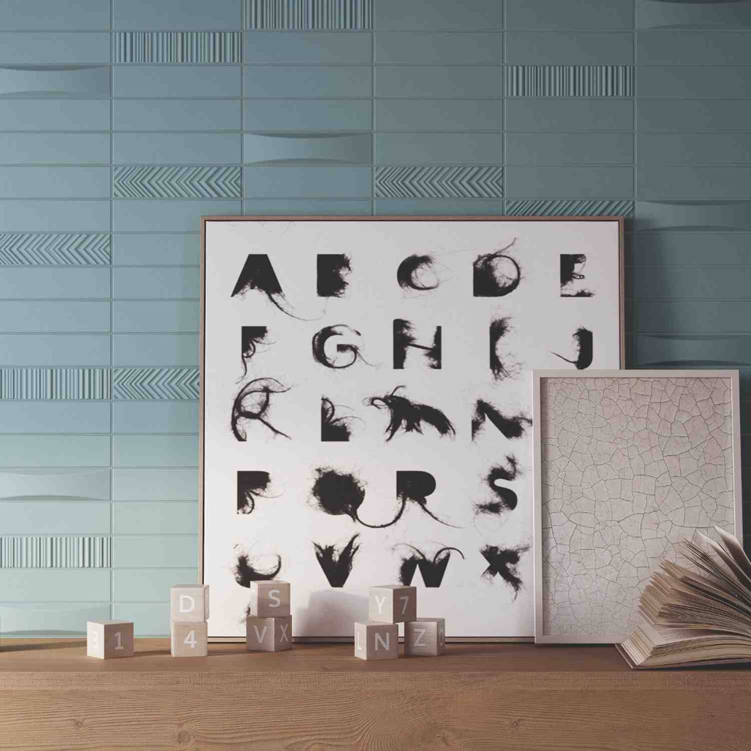 Elios Dust matte chevron ceramic wall tiles in ice teal blue-green with mixed chevron and wave relief patterns installed as accent wall with framed black and white typography art poster and textured art print