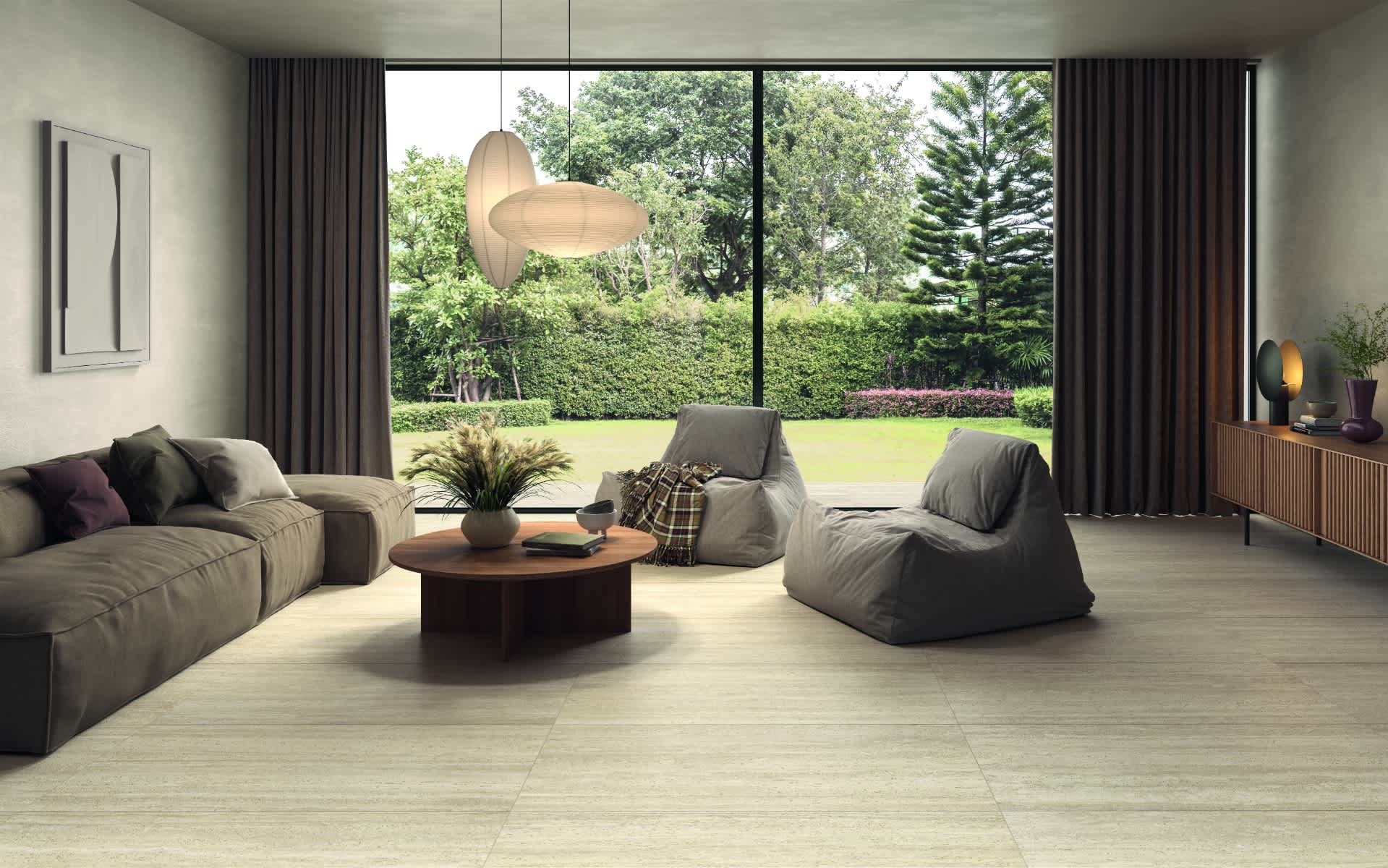 Castelvetro Firenze vein cut porcelain stoneware large format floor tiles in beige installed in spacious contemporary living room with brown sectional sofa grey bean bag chairs round wooden coffee table sculptural pendant light dark curtains and panoramic