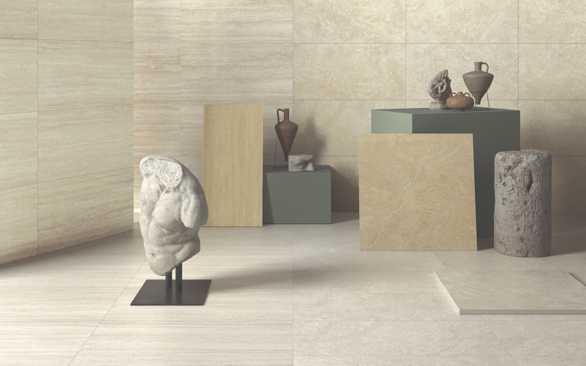 Castelvetro Firenze porcelain stoneware tile collection showroom display featuring vein cut large format panels in bianco avorio and greige colorways with classical marble bust sculpture dark display pedestals ceramic vessels and stone floor tiles