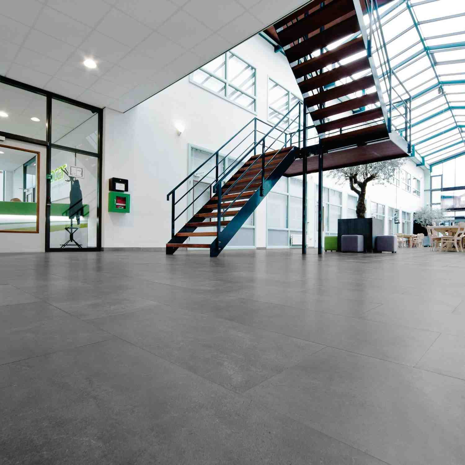 Dark Grey Porcelain Stoneware Floor Tile in Modern Commercial Space with Metal Staircase