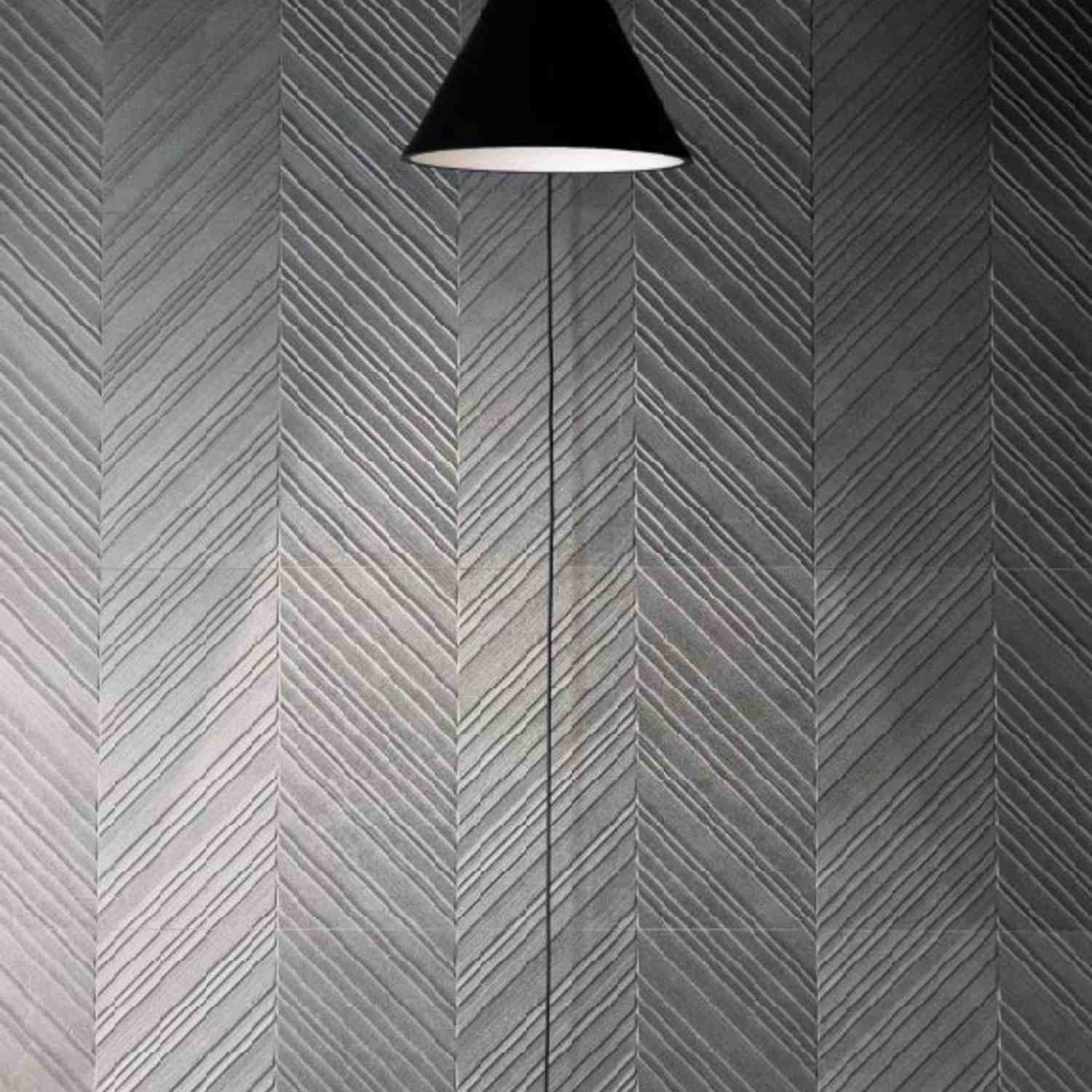 Dark Charcoal Chevron Herringbone Porcelain Wall Tile Close-Up with Pendant Light