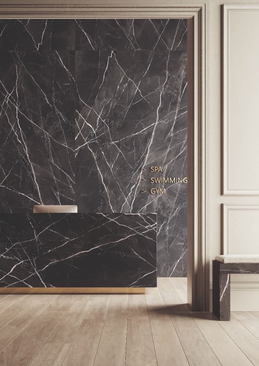Italstone porcelain slab in Calacatta Black, installed as a dramatic hallway feature wall with bright white veining on a deep black ground.