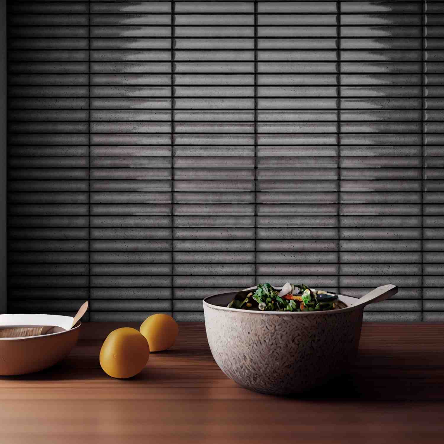 Estudio Ceramico Karatsu glazed porcelain wall tiles in charcoal grey horizontal linear pattern installed as kitchen backsplash with glossy finish and cooking accessories