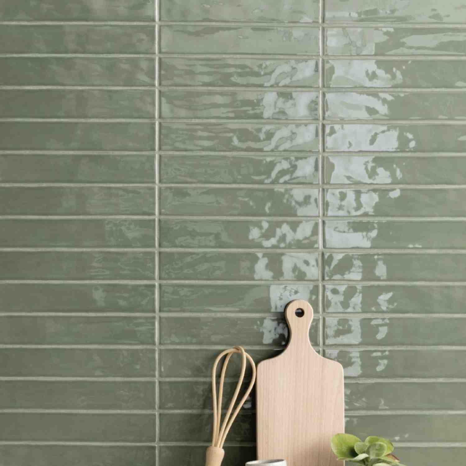 Ceramica Colli Kyushu verde glossy ceramic wall tiles in horizontal stacked layout with weathered lustre glaze effect