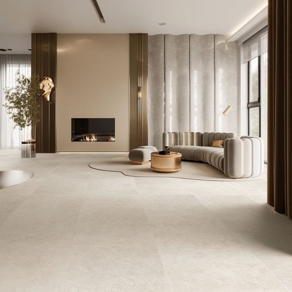 Overland Limestone taupe matte porcelain floor tiles in contemporary living space with linear fireplace, cream upholstered sofa, and natural wood accents