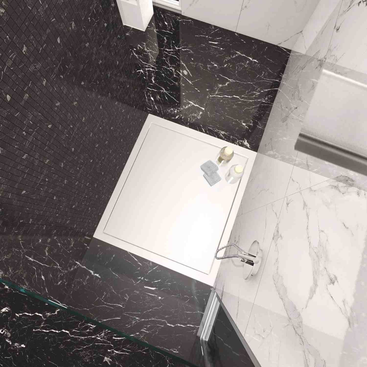 Casalgrande Marmoker polished porcelain stoneware in luxury bathroom overhead view featuring Nero Marquinia dark marble-look wall tiles and Statuario white marble-look floor tiles with white shower tray