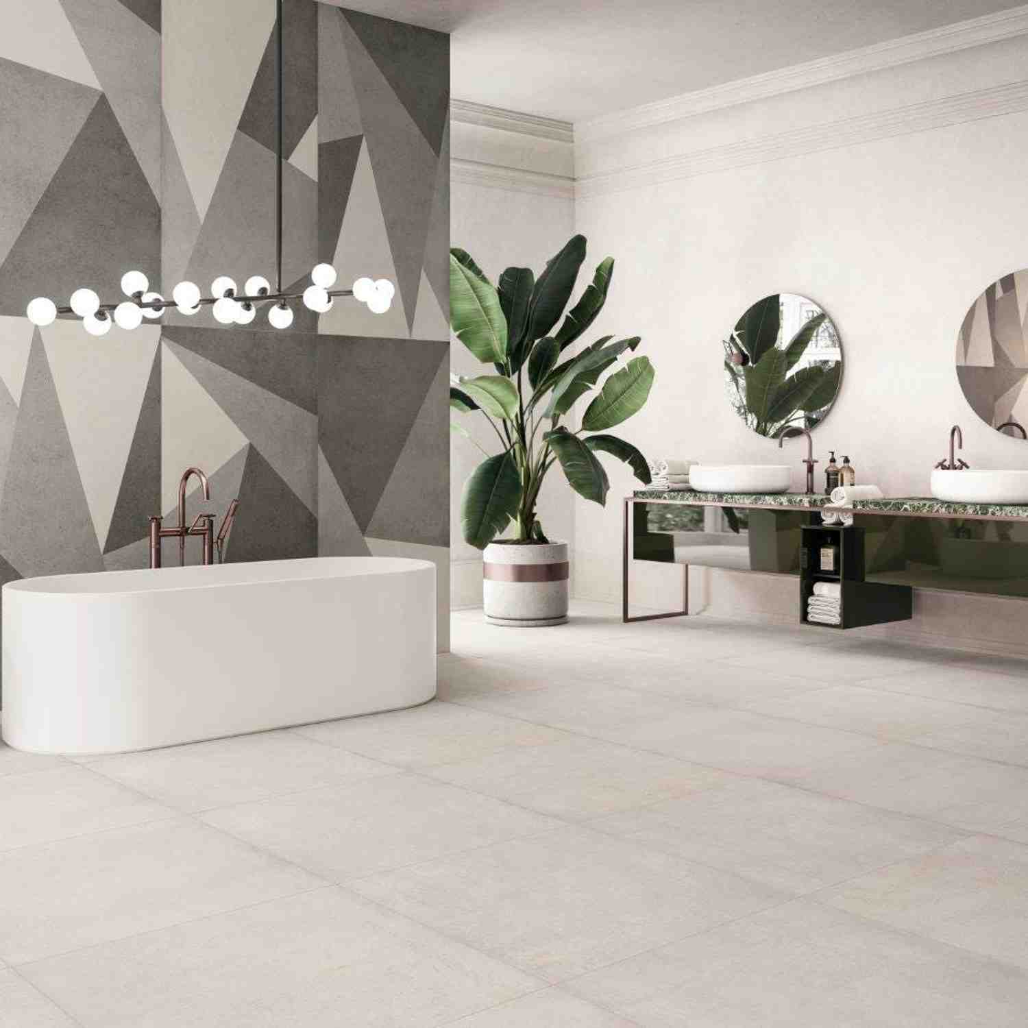 Refin Masterplan bathroom scenes with geometric wall pattern in Mist, Cinder and Nickel tones, freestanding bathtub with globe chandelier, dual vessel sink vanity with round mirrors and tropical plant