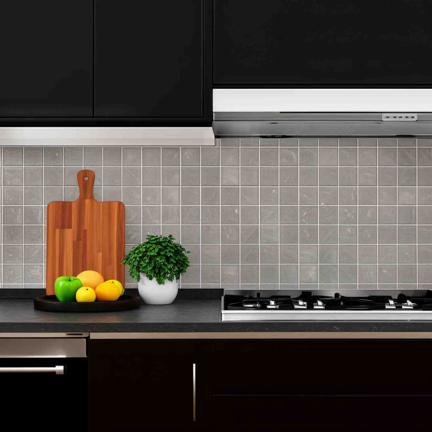 Ergon Materastone Beige porcelain stoneware backsplash tiles in a kitchen with black cabinetry, wooden cutting boards, fresh fruit, potted herbs, and gas cooktop