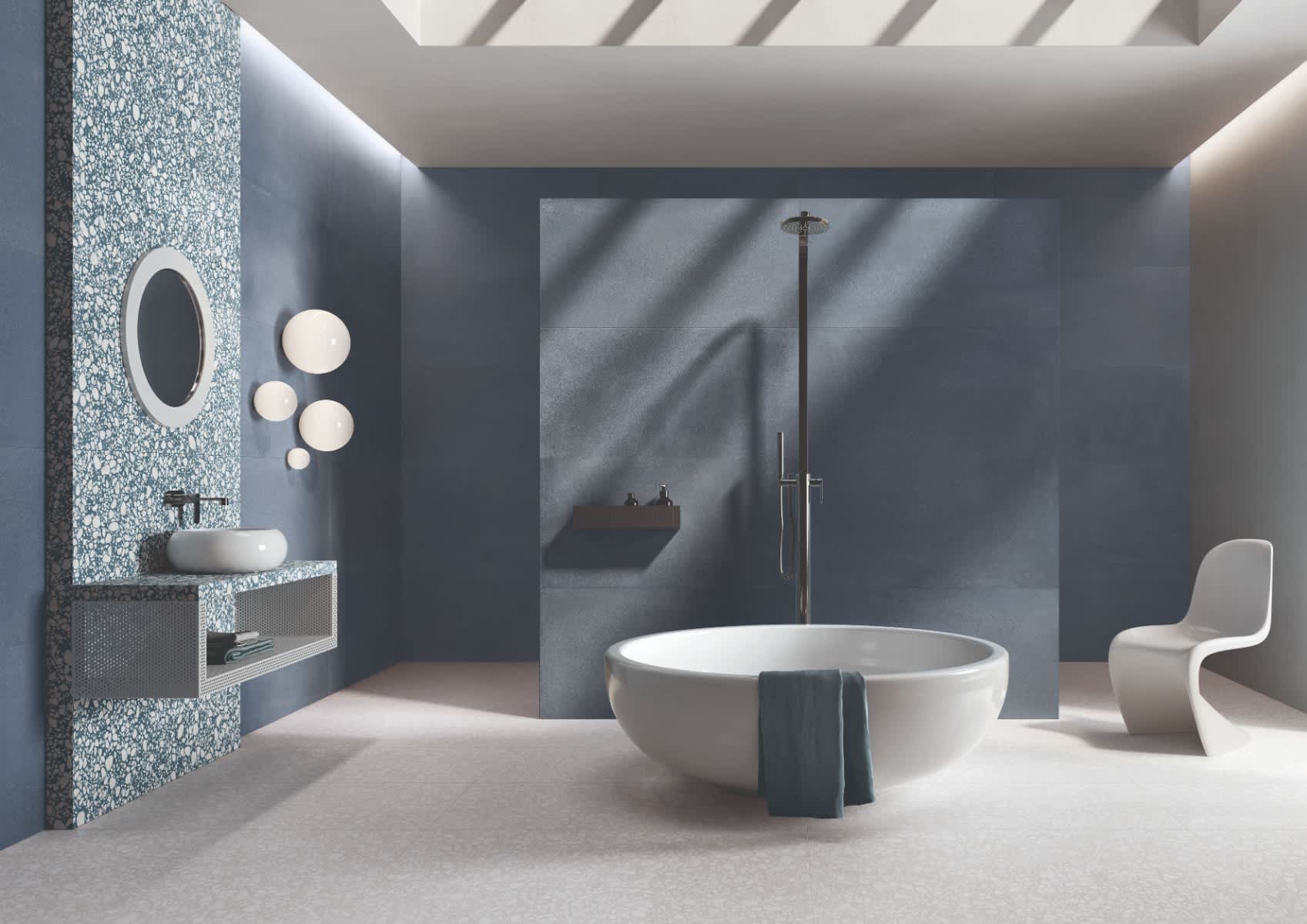 Emilceramica Medley Blue Minimal walls with Green Minimal mosaic accent wall in a modern bathroom featuring white freestanding bathtub, rain shower, round wall sconces, oval mirror, vessel sink vanity, and sculptural chair