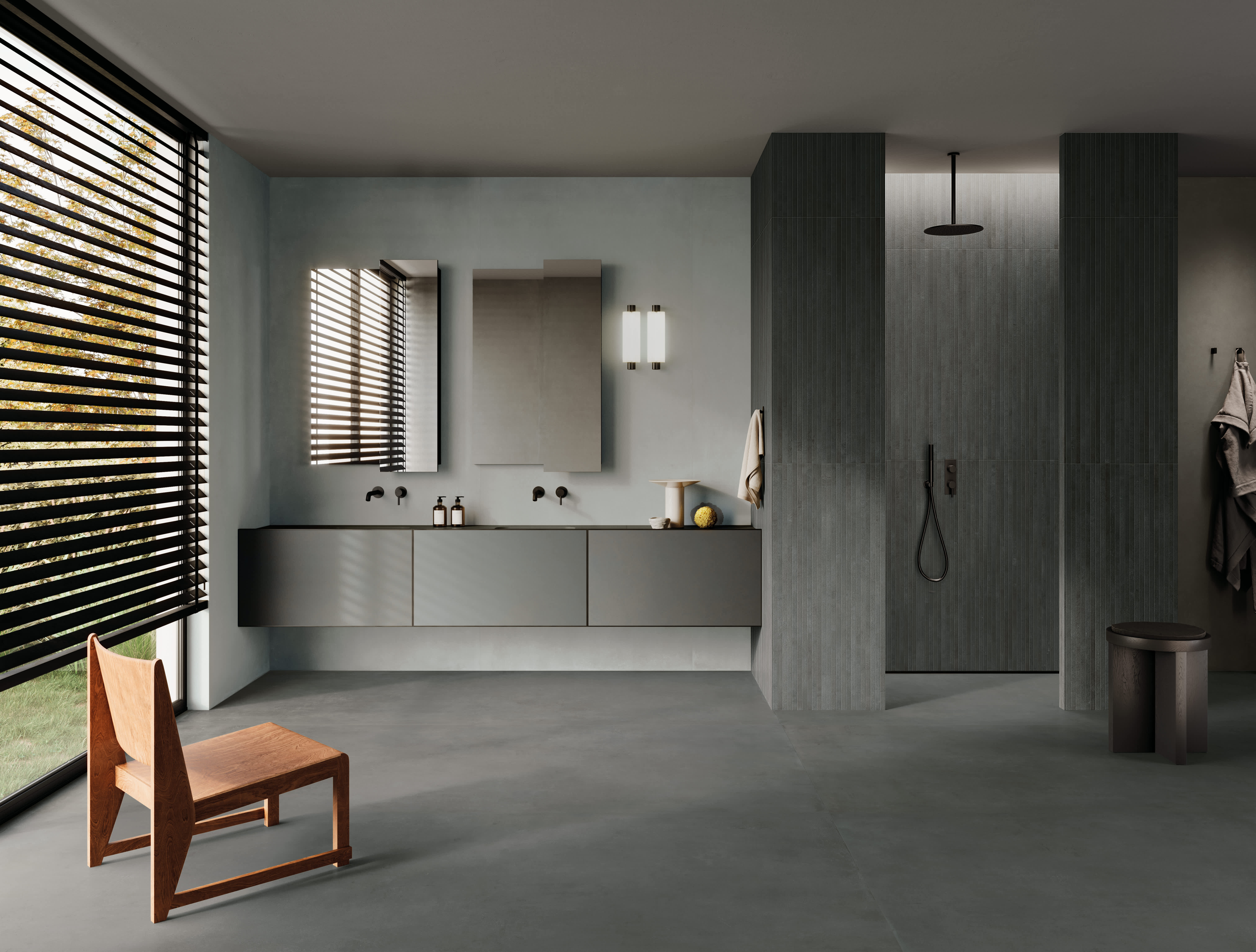 Bathroom with pale grey I Cementi porcelain slab walls, a dark charcoal floor, ribbed shower walls, floating vanity and slatted blinds.