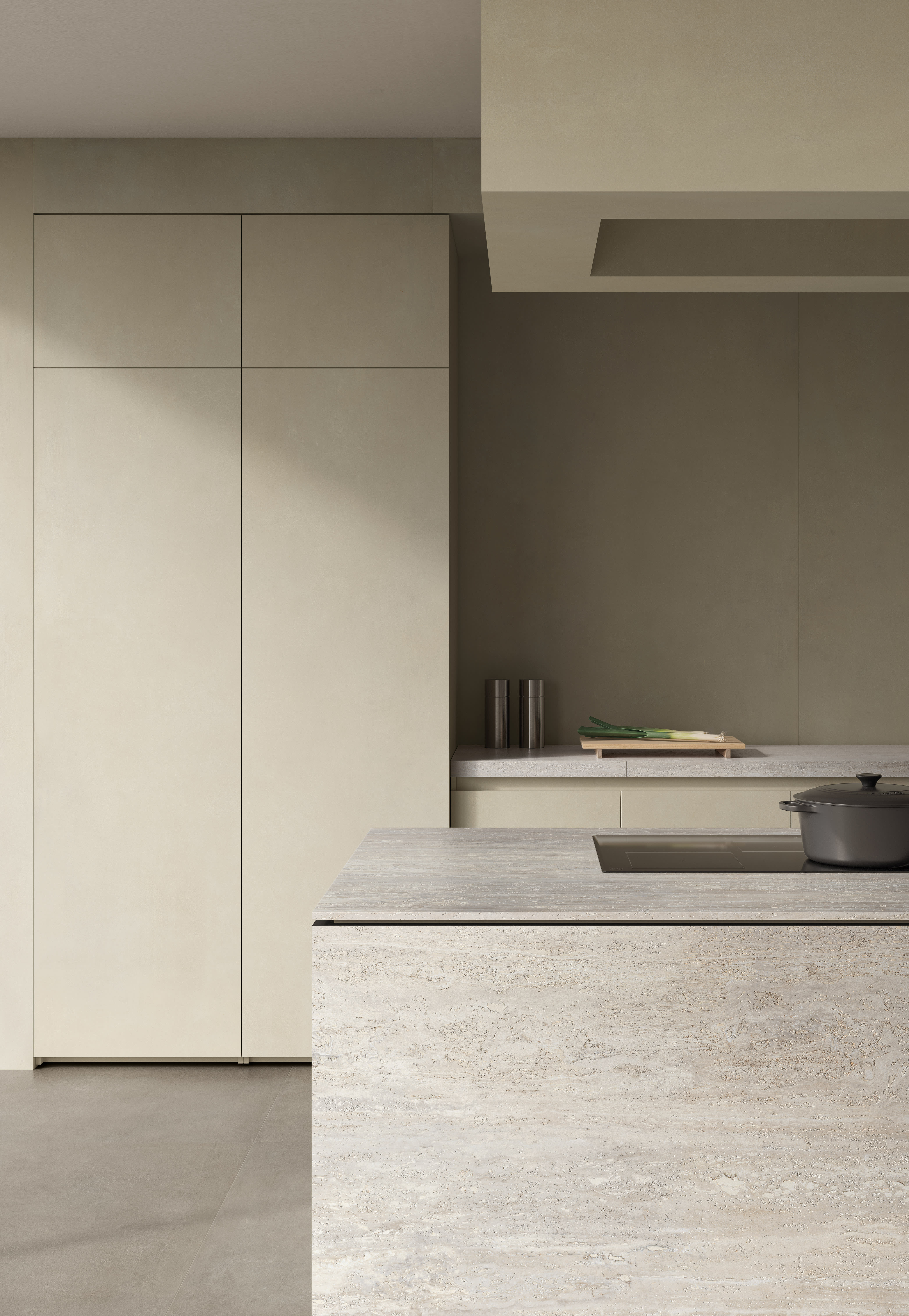 Kitchen in soft beige I Cementi porcelain slab, with flush tall cabinetry, a travertine-look island and a warm grey floor.