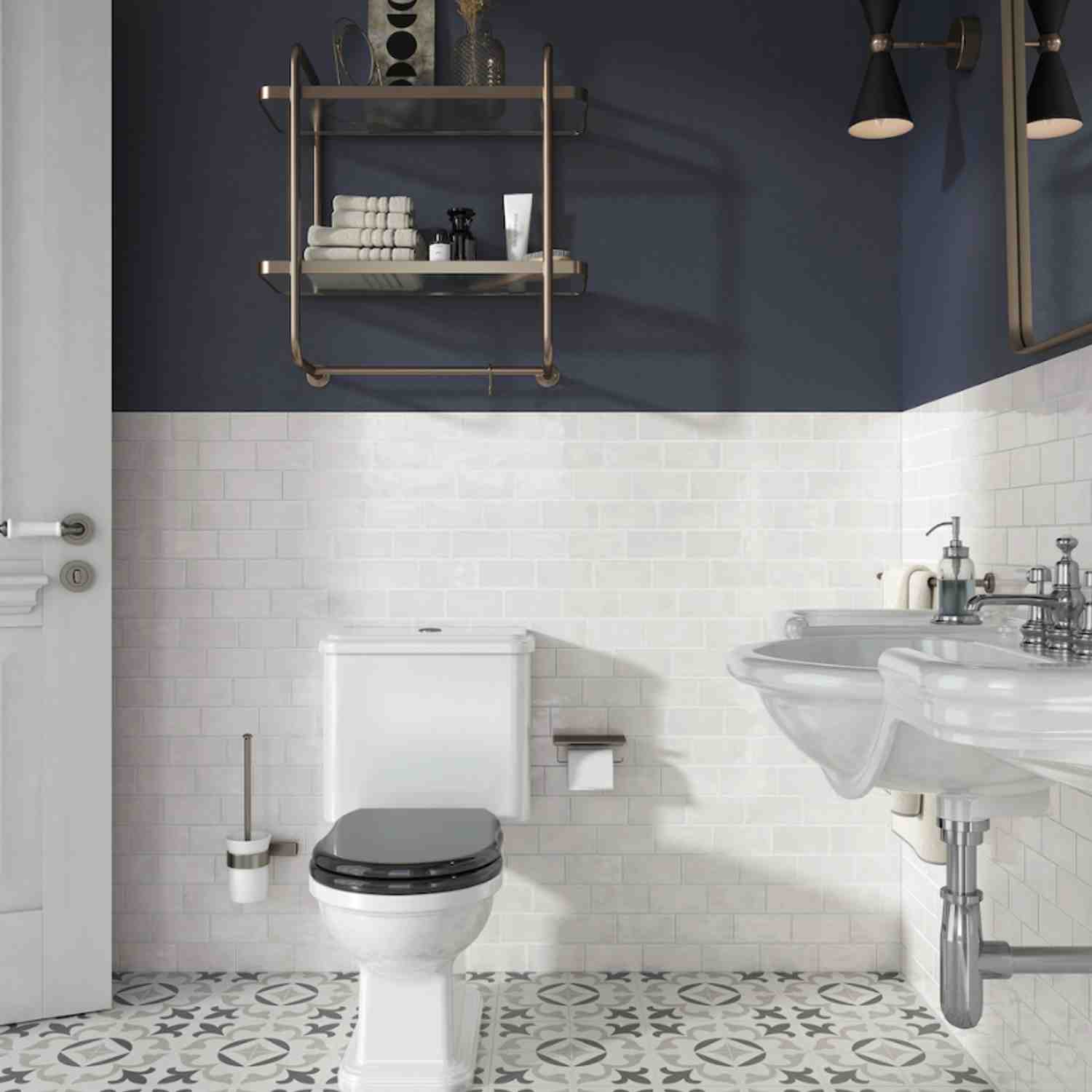 Terratinta Memorie Blu di Prussia dark navy glossy ceramic wall tiles in bathroom with brass towel shelf, black cone pendant lights, and toiletry accessories