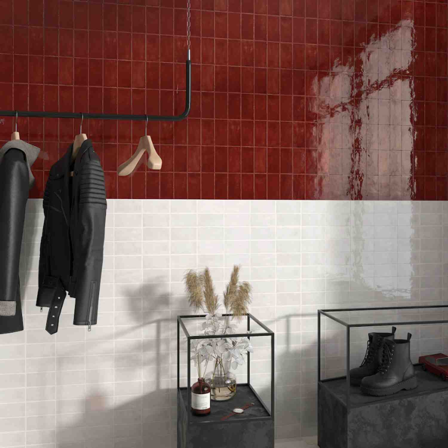 Terratinta Memorie Scarlatto deep red glossy ceramic wall tiles in entryway with black pipe clothing rack and hanging jackets