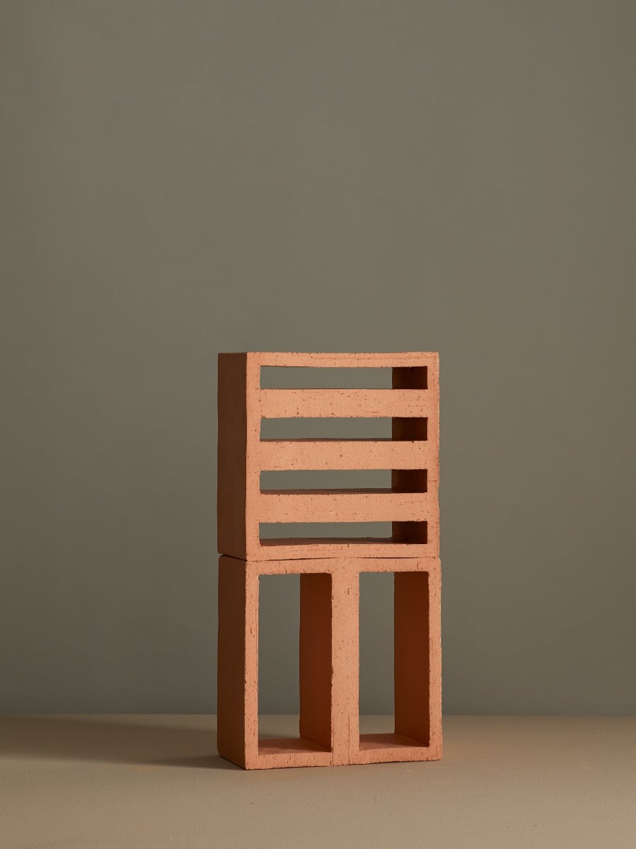 Mutina Tally Narrow single terracotta module showing artisanal extruded block with four horizontal slot openings in natural Argilla matte finish on neutral background