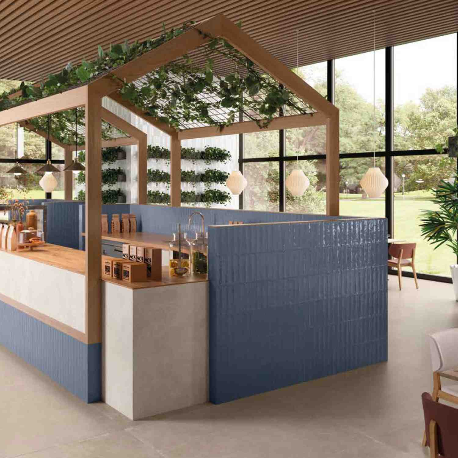 Ergon Total Brick ceramic tiles in blue and cream cladding a commercial bar counter in a restaurant setting with wooden beam structure, pendant lights, and green living wall