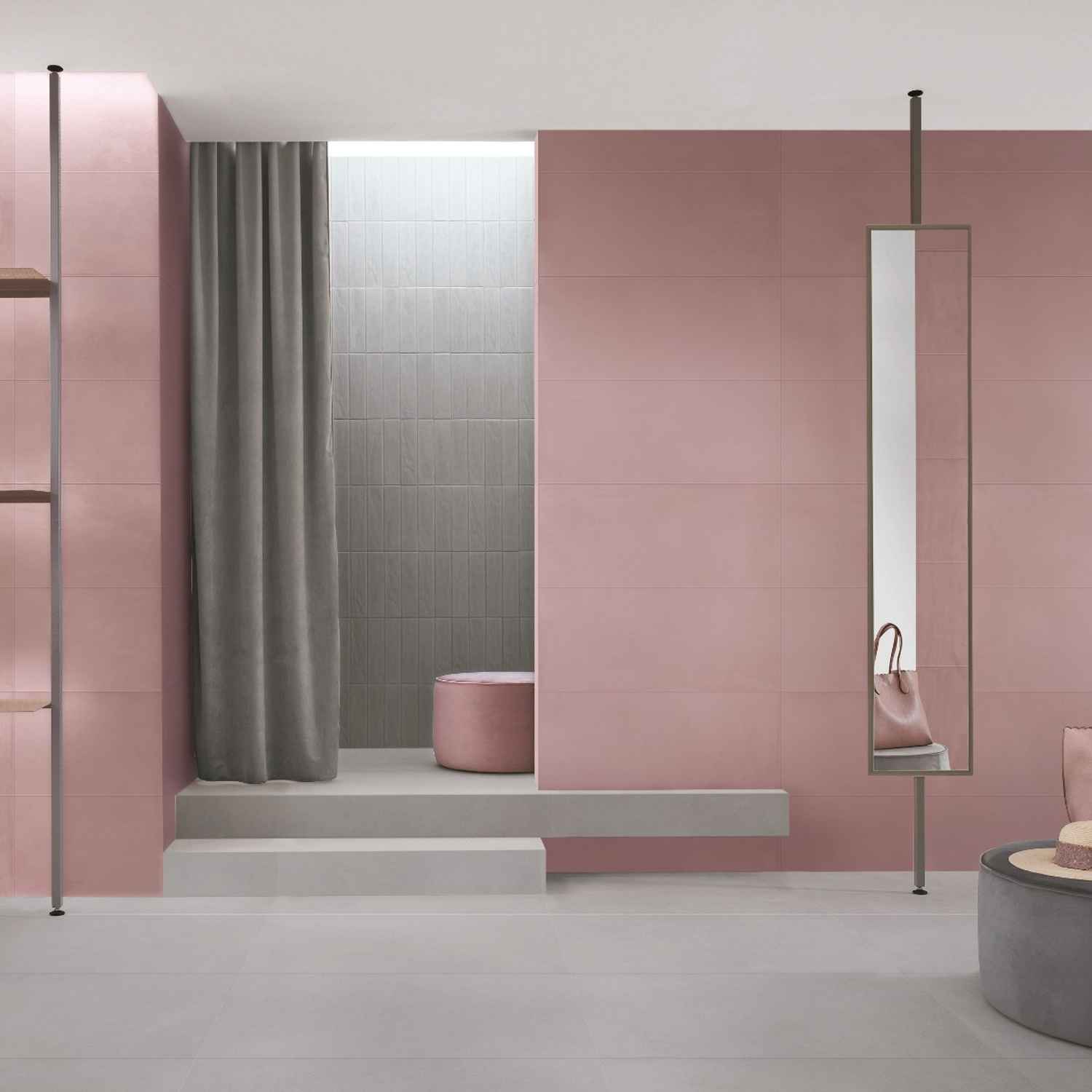 Florina Urban Cement porcelain wall tiles in pink blush and sage green in a modern bathroom with shower niche, pink pouf ottoman, floor-length mirror, and grey curtain