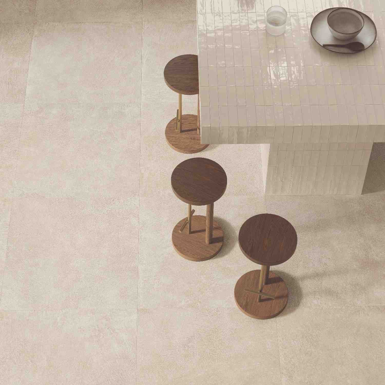 Sixty beige porcelain floor tile overhead view with wooden bar stools in cafe setting