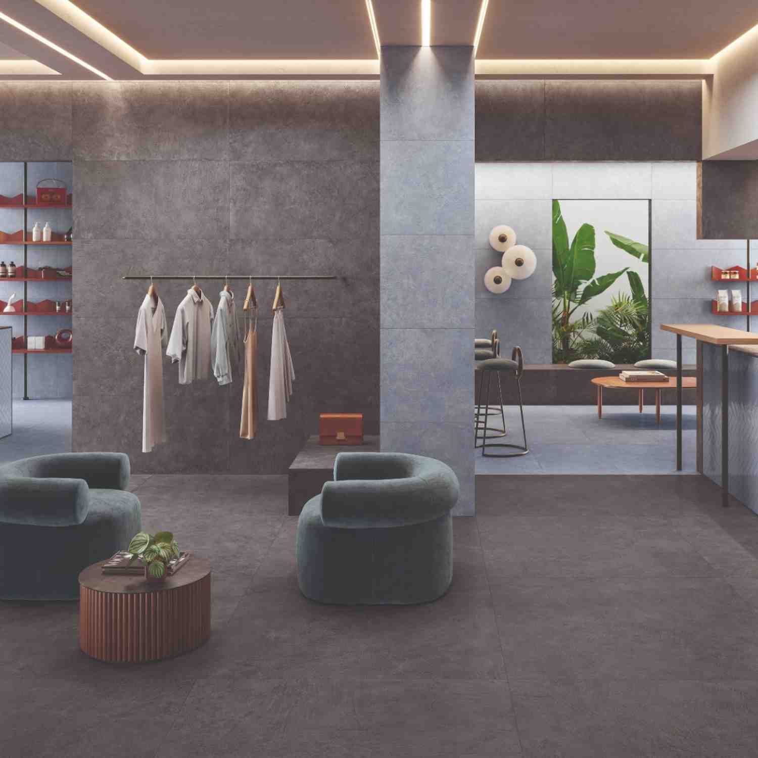 Sixty dark porcelain floor tile in modern boutique with green velvet seating, clothing rack, and display shelving