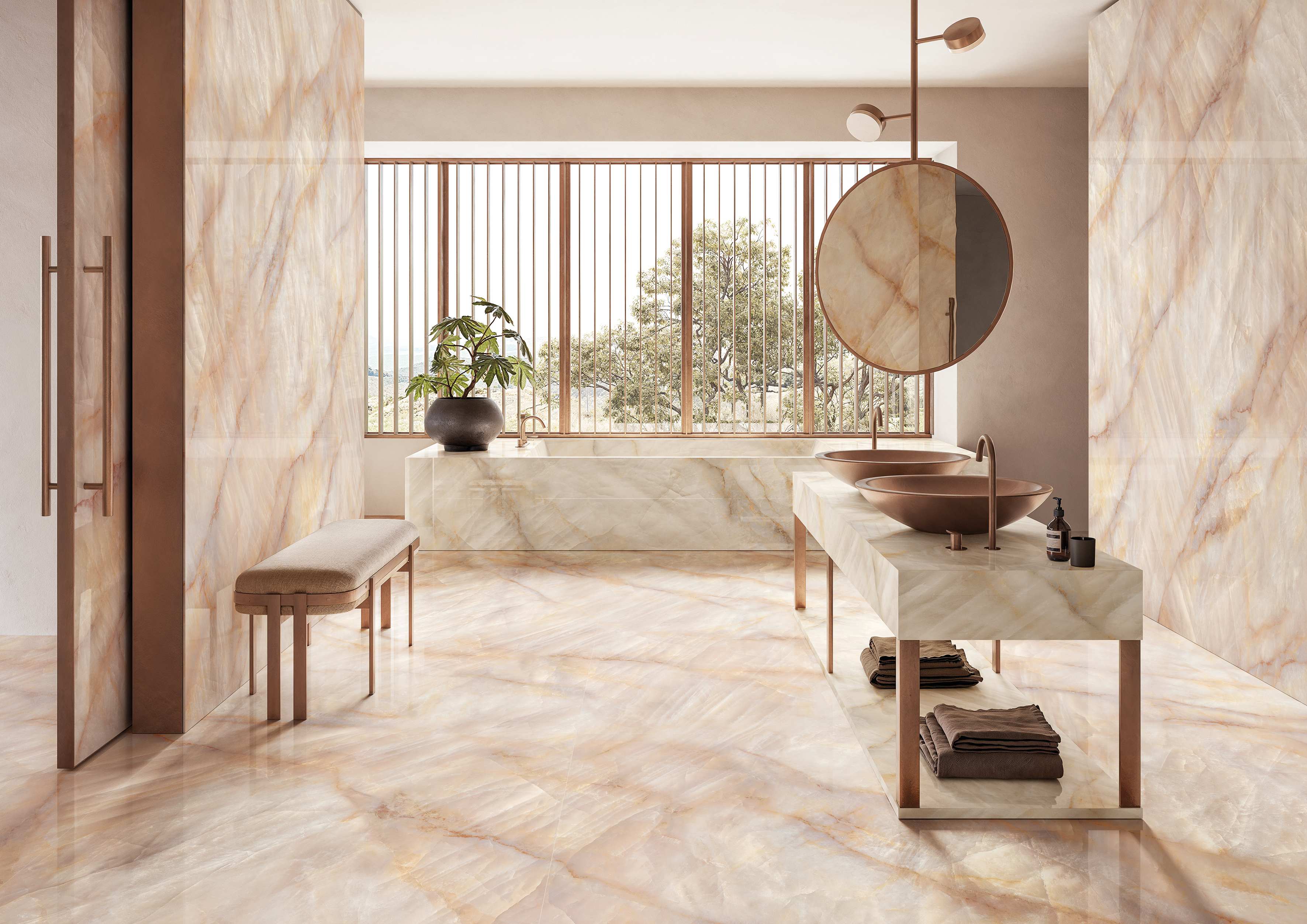 Tele di Marmo Crystal porcelain tile in Extra Pink lining a spa-style bathroom with Extra Ivory accents and brass fixtures